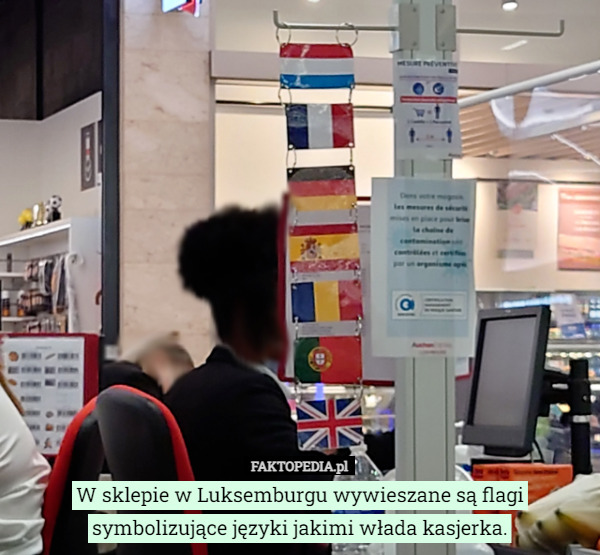 W sklepie w Luksemburgu wywieszane są flagi symbolizujące języki jakimi włada kasjerka. 